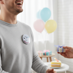 A person is smiling and receiving a small gift box with a ribbon, while colorful balloons are floating in the background.
